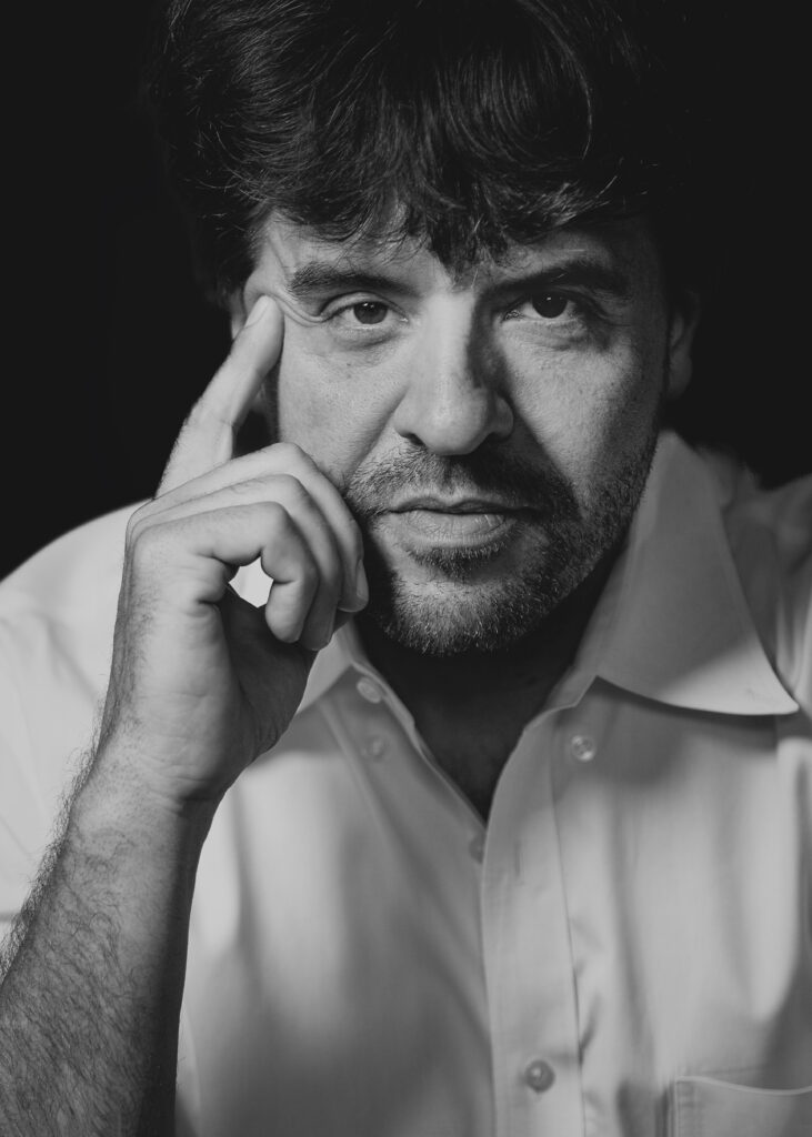 Portrait of Karl Deisseroth photographed by Christopher Michel in 2022.